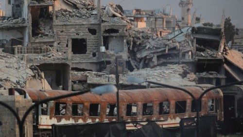 FILE PHOTO: Destroyed buildings are seen near a train station in Damascus, Syria, September 12, ...