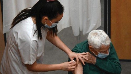 A nurse administers an injection of the Pfizer-BioNtech Covid-19 vaccine to a patient at Zinga Zanga ...