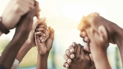 Cropped shot of a group of businesspeople holding their hands in solidarity Cropped shot of a group of businesspeople holding their hands in solidarity