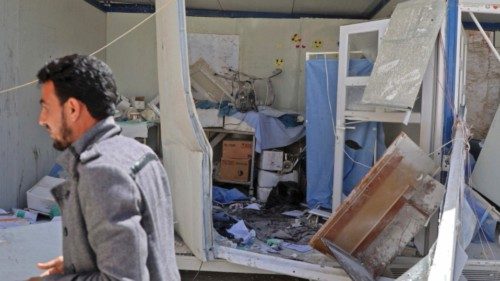 A man walks past a damaged room at the entrance of a field hospital in the the village of Atareb in ...