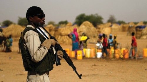 A Nigerien soldier stands guard in a camp of the city of Diffa during the visit of Niger's Interior ...
