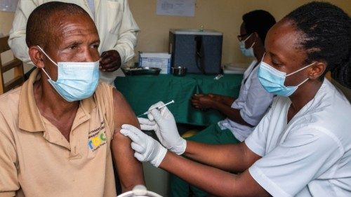 FILE PHOTO: A man receives a vaccine against the coronavirus disease (COVID-19) at the Masaka ...