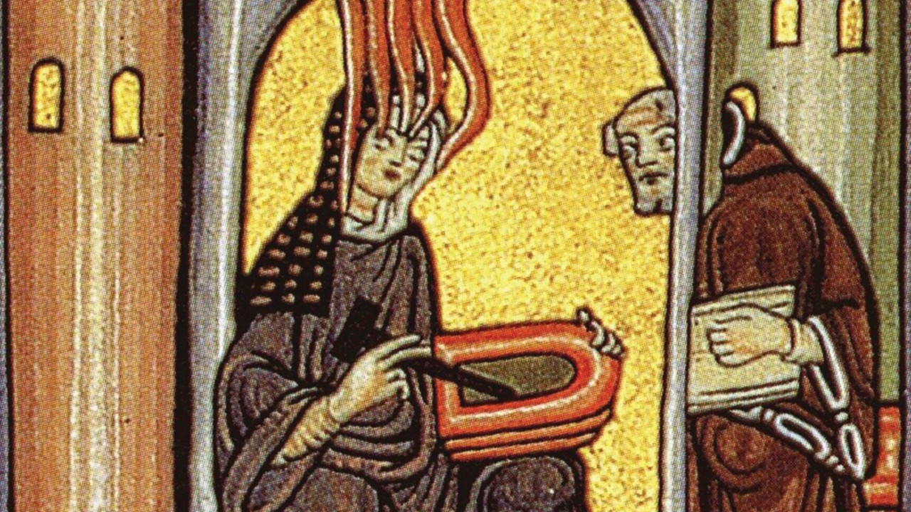 Ildegarda di Bingen riceve una visione e la descrive al suo segretario Miniatura dal Codice Rupertsberg del Liber Scivias (Wikimedia commons)