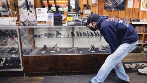 TINLEY PARK, ILLINOIS - APRIL 08: Alexander Carey shops for a new handgun at Freddie Bear Sports on ...