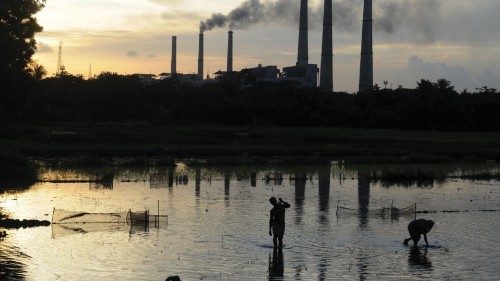 (FILES) In this file photo taken on July 26, 2011, Indian labourers prepare the flooded field for ...