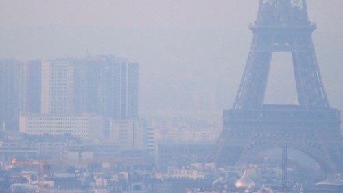 FILE PHOTO: The Eiffel Tower is surrounded by a small-particle haze which hangs above the skyline in ... FILE PHOTO: The Eiffel Tower is surrounded by a small-particle haze which hangs above the skyline in ...