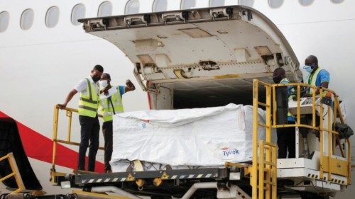 FILE PHOTO: Workers offload boxes of AstraZeneca/Oxford vaccines as the country receives its first ...