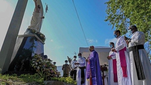 The head of the Roman Catholic church in Sri Lanka, Cardinal Malcolm Ranjith (C) blesses a memorial ...