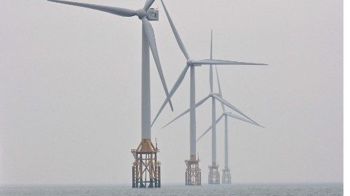 This picture taken on March 4, 2021 shows turbine towers at an offshore wind farm in waters some 10 ...