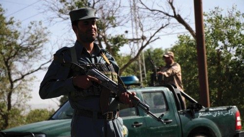 epa09156307 Afghan security officials stands guard at a roadside checkpoint in Herat, Afghanistan, ...