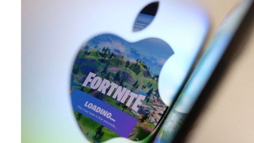 This illustration photo shows the opening screen of Epic GamesÃ­ Fortnite reflecting onto the Apple ...