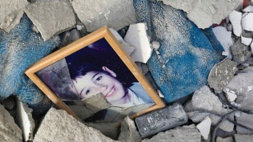 A picture is seen among debris inside a synagogue damaged by a rocket, as Israeli-Palestinian ...