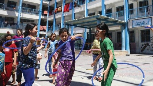 Children play at a school run by the United Nations Relief and Works Agency for Palestinian Refugees ...