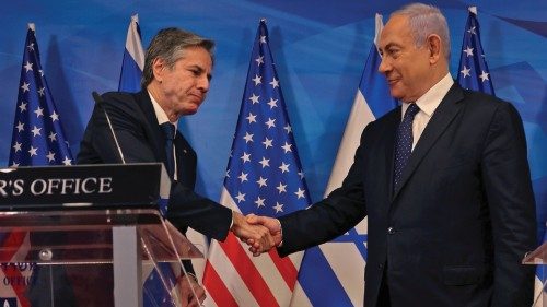 Israeli Prime Minister Benjamin Netanyahu and U.S. Secretary of State Antony Blinken shake hands as ...