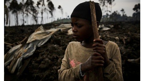 A Congolese child, Jolie, 11, prepares to evacuate from recurrent earth tremors as aftershocks after ...