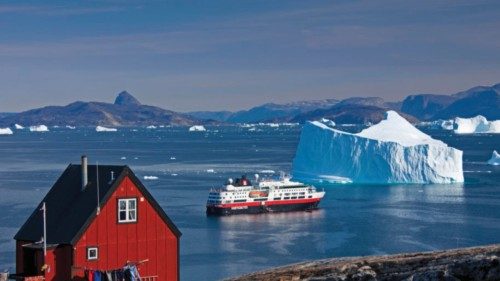 Cruise ship among icebergs in the Uummannaq fjord, North-Greenland, Greenland