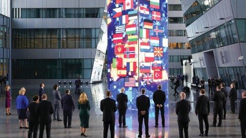 NATO heads of the states and governments look at a digital installation after posing for a family ...