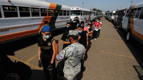 People stand in line to receive the Johnson & Johnson vaccine against the coronavirus disease ...