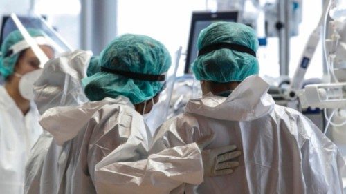 Health workers wearing overalls and protective masks work in the intensive care unit of the GVM ICC ...