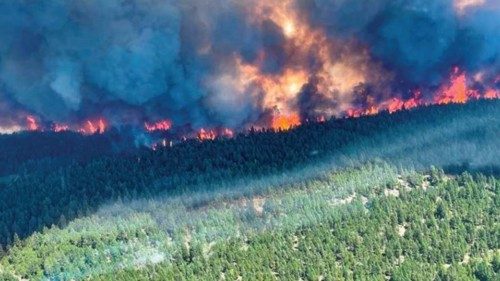 Smoke and flames are seen during the Sparks Lake wildfire at Thompson-Nicola Regional District, ...