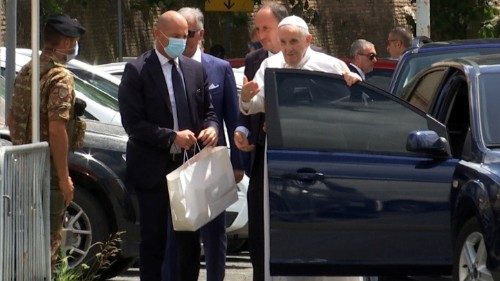 Pope Francis leaves the car to greet policemen before entering the Vatican after being discharged ...