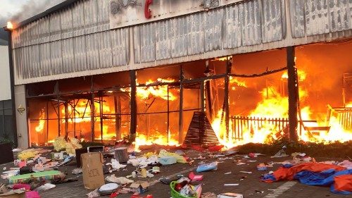 A fire engulfs Campsdrift Park, which houses Makro and China Mall, following protests that have ...
