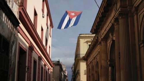 A Cuban flag flies over a street amid concerns about the spread of the coronavirus disease ...