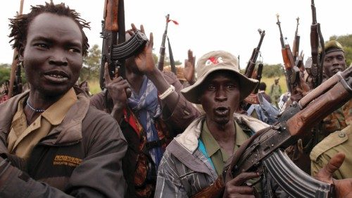 SPLA-IO (SPLA-In Opposition) rebels hold up guns in Yondu, the day before an assault on government ...