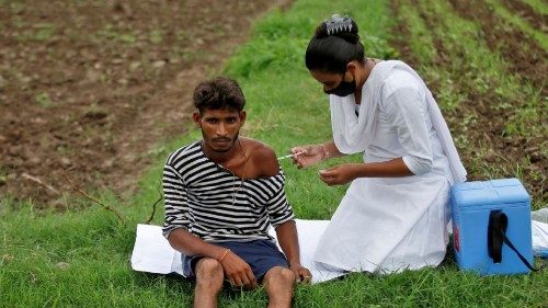 FILE PHOTO: Healthcare worker Jankhana Prajapati gives a dose of the COVISHIELD vaccine against the ... FILE PHOTO: Healthcare worker Jankhana Prajapati gives a dose of the COVISHIELD vaccine against the ...