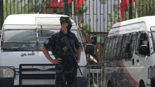 Tunisian police stand guard outside the parliament in Tunis on July 27, 2021. - Tunisia, the ...