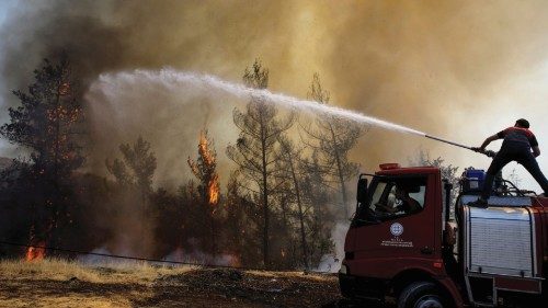 A firefighter tries to extinguish a wildfire near Marmaris, Turkey, August 1, 2021. REUTERS/Umit ...