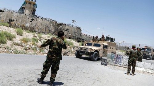 FILE PHOTO: Afghan soldiers stand guard at a checkpoint outside the U.S Bagram air base, July 2, ...