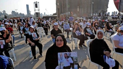 Relatives of the 2020 Beirut blast victims attend a Maronite Christian mass at the port of Lebanon's ...