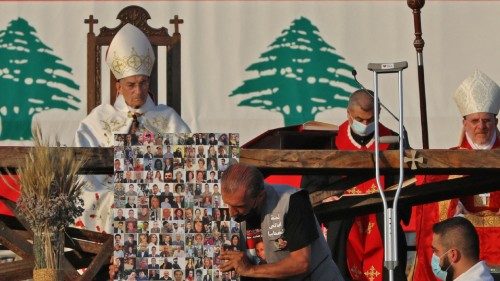 Maronite Christian Patriarch Bechara al-Raii (top L) heads mass at the port of Lebanon's capital ...