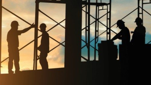 Silhouette of engineer and construction team working safely on scaffolding on high rise building. ...