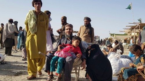 TOPSHOT - Stranded people wait for the reopening of the Pakistan-Afghanistan border crossing point ...