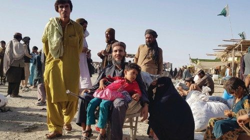 TOPSHOT - Stranded people wait for the reopening of the Pakistan-Afghanistan border crossing point ...