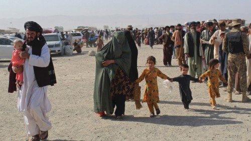 An Afghan family arrives at the Pakistan-Afghanistan border crossing point in Chaman on August 20, ... An Afghan family arrives at the Pakistan-Afghanistan border crossing point in Chaman on August 20, ...