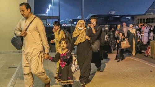Evacuees from Afghanistan arrive at Al-Udeid airbase in Doha, Qatar in this recent undated handout. ...