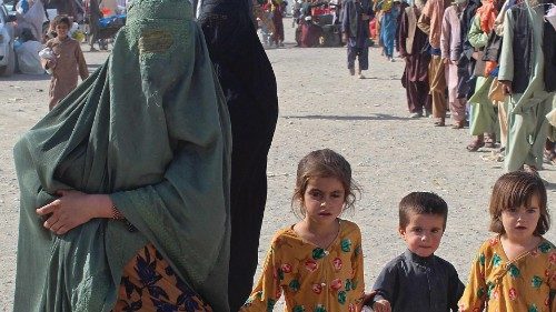 An Afghan family arrives at the Pakistan-Afghanistan border crossing point in Chaman on August 20, ...