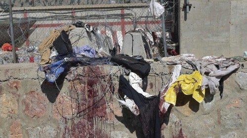 Clothes and blood stains of Afghan people who were waiting to be evacuated are seen at the site of ... Clothes and blood stains of Afghan people who were waiting to be evacuated are seen at the site of ...