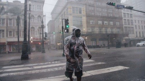 NEW ORLEANS, LOUISIANA - AUGUST 29: A person crosses the street during Hurricane Ida on August 29, ...