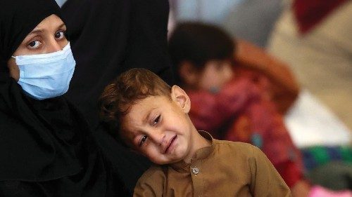 Evacuees from Afghanistan sit at the U.S. airbase in Ramstein, Germany, August 28, 2021.  ...