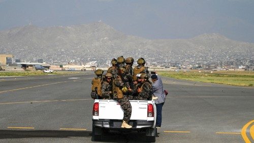 Members of the Taliban Badri 313 military unit ride a vehicle on the runway of the airport in Kabul ... Members of the Taliban Badri 313 military unit ride a vehicle on the runway of the airport in Kabul ...