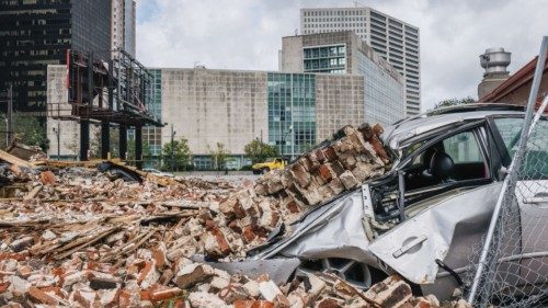 NEW ORLEANS, LOUISIANA - AUGUST 30: A car is seen under rubble after a building was destroyed by ...