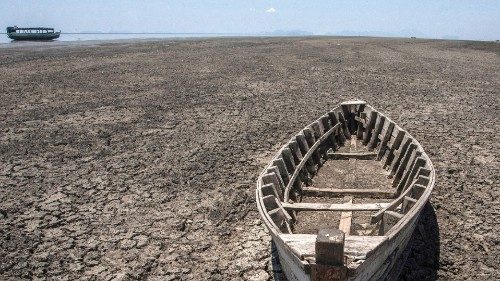 A wooden boat lies on the dry lake bottom at the dried inland Lake Chilwa's vacated Kachulu Harbour ...