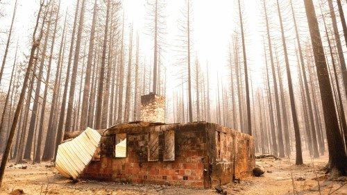 TOPSHOT - The remains of a home smolders during the Caldor fire in Twin Bridges, California on ...