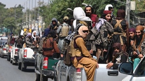 A convoy of Taliban fighters patrol along a street in Kabul on September 2, 2021. (Photo by Aamir ...