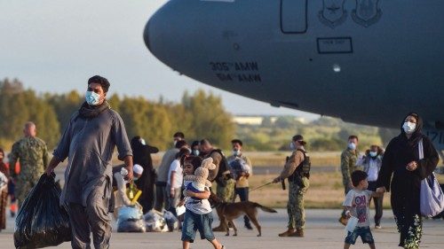 Refugees disembark from a US air force aircraft after an evacuation flight from Kabul at the Rota ...