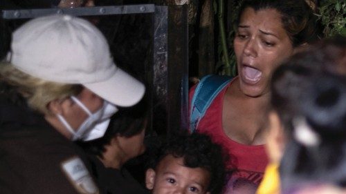 Mexican migration officers detain Central American and Haitian migrants heading in a caravan to the ...